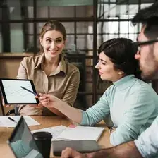 Business team reviewing campaign results on a tablet